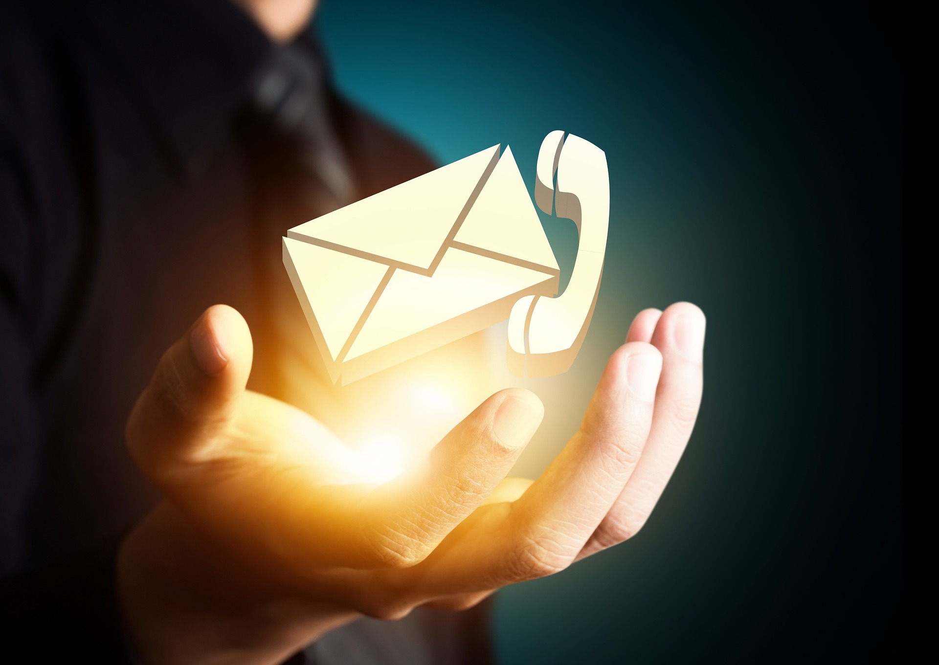 email icon being held in hand